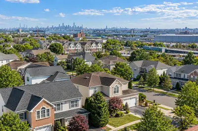 Illustrative residential rooftop scene, not a verified photograph of the named city